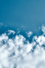Blue sky with white fluffy clouds