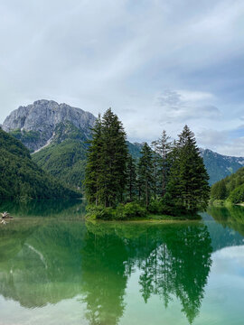 Mountain lake with reflection and trees