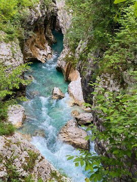 Mountain canyon from above with turquoise blue and rushing water