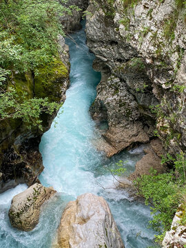 Mountain canyon from above with turquoise blue and rushing water