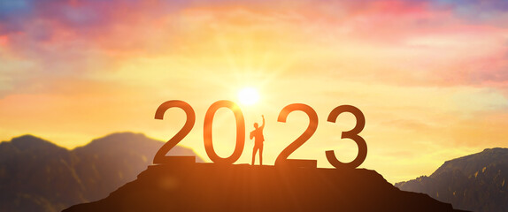 2023. Welcome Happy new year 2023. Man meets dawn in mountains. happy New Year 2023. New Start...