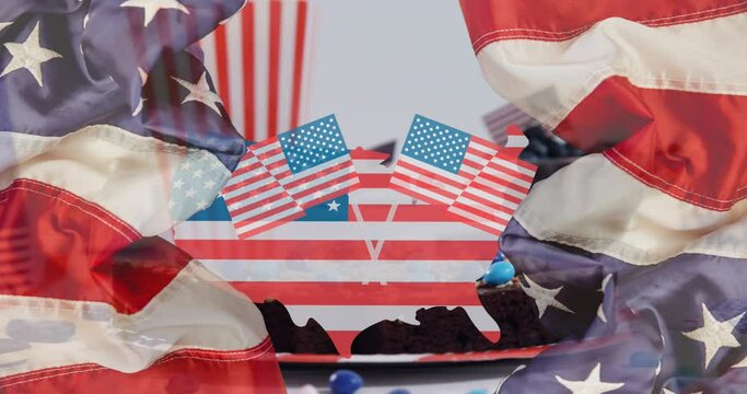 Animation of country coloured with flag of usa over cake and flags of usa