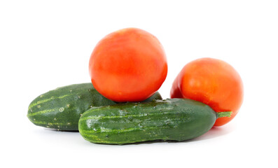 Ripe red tomatoes with cucumbers.