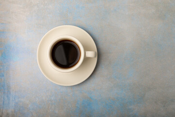 Fragrant coffee in a cup on a marble background.Espresso. Morning drink. Cheerful morning concept. Place for text. Place to copy.