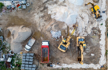 aerial top view of a construction site with heavy machines