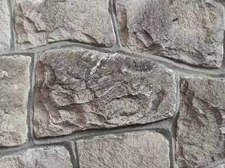 texture of stone wall. stone wall as background or texture. part of a stone wall for background
