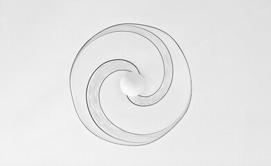 White ball on the center of a spiral drawing