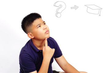 Thinking boy on white background with graduation cap. Bright ideas and problem solving concept.