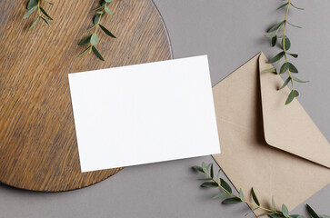 Invitation card mockup with envelope and botanical decorations
