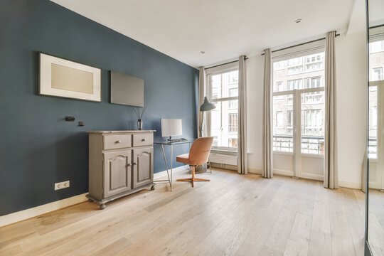 Room with a desk next to a window