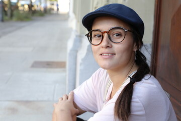 Cute woman wearing vintage style hat and eyeglasses 