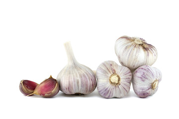 Garlic bulbs and cloves in close-up on white