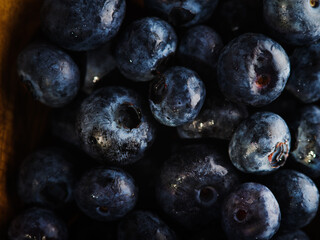 Lots of ripe blueberries. Macro shot. Vitamins, antioxidants, sweet healthy food, dessert. There are no people in the photo. Background. Wallpaper. Texture.