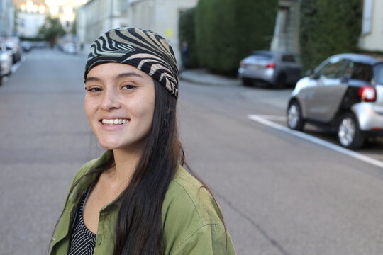 Young ethnic urban woman wearing a bandana 