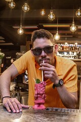 Latin Barman preparing alcoholic cocktail 