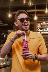Latin Barman preparing alcoholic cocktail 