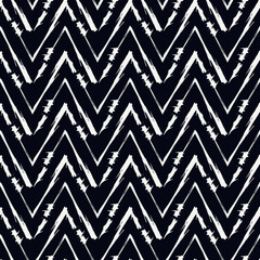 Ethnic seamless pattern. Freehand zigzag stripes print. Boho chic background. Tribal style wallpaper. Brush wavy lines. Handdrawn geometric ornament. Chevron backdrop. Indigenous image. Vector art.