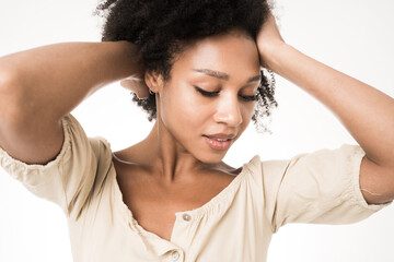 Naklejka premium Woman portrait of a pure skin model posing in a photo studio on a white background