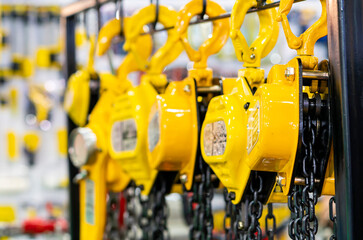 Close up industrial manual chain hoist equipment labor saving machine for lifting object and reduce work load hang on the line