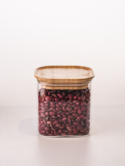 Glass jars with pasta, various cereals and grains. Foods storage concept .