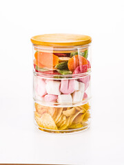 Composition with delicious candies on wooden background.