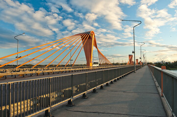 cable-stayed bridge in Riga, in the photo south bridge in the evening against the background of blue sky and clouds