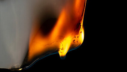 burning plastic close up, plastic is burning, melts and drips