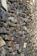 stone wall texture composed of various colored stones