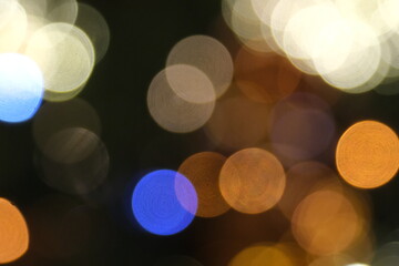 multicolour defocused glitter lights background. Rounded defocused lights. Abstract bokeh back.