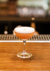view on wine glass with red drink decorated. Blurred background