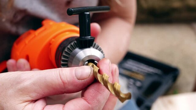 Fitting bit in electric power drill for diy 
