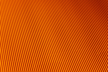 Orange color design of corrugated paper, cardboard. The template for placement of text. Blurred close-up. Also can be used as background and example of texture
