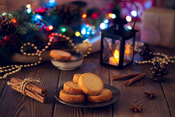 Obraz na płótnie Canvas Christmas cookies with festive decoration in an evening cozy setting.