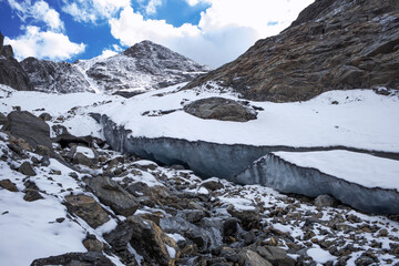 Obraz premium Glacier high in the mountains. A high layer of ice permafrost.