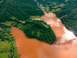 Aerial photography of the industrial decanting lake at Geamana in Romania. The photography was shot from a drone revealing the lake's vibrant colors and contrasts.