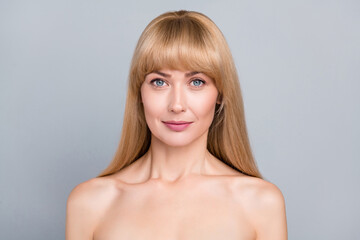 Fototapeta premium Portrait of aesthetic mature lady look dermatology wrinkles rejuvenating isolated over grey color background