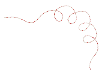 Curled white and red Christmas wrapping rope in a corner arrangement isolated on white