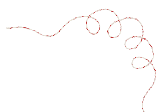 Curled white and red Christmas wrapping rope in a corner arrangement isolated on white