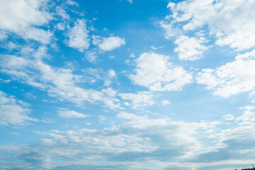 Naklejka na ściany i meble cloudy blue sky with white fluffy clouds. skyscape background