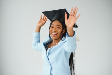 Happy beautiful black african american girl with hat graduates