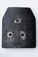 Bullet hole in composite body armour.