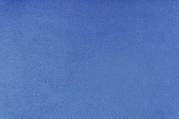 Texture of natural fabric or cloth. Fabric texture diagonal weave of natural cotton or linen textile material. Blue canvas background. Decorative fabric for curtain, furniture, walls, clothes