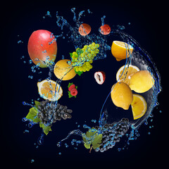 Panorama, wallpaper with fruits in water - fresh mango, lemon, grapes, lychees, raspberries are full of vitamins and delicious