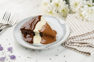 THE CHOCOLATE FONDANT cake slice served in a dish isolated on table side view of arabian dessert