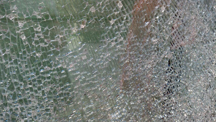 Strained glass broken window from explosion splinter. Shattered glass. Abstract blurred defocused broken glass texture background. Abstract background. Blurred image