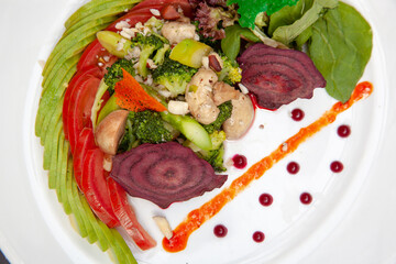 Vegetarian dishes such as salads, quinoa, avocado, vegetables and wraps