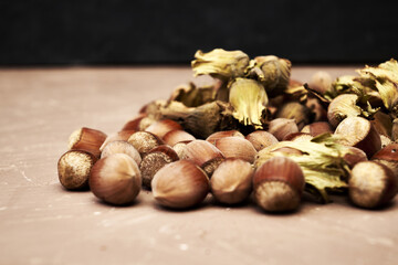 hazelnuts scattered on the table close-up copy space