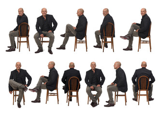 large group of same bald man with blazer and jeans sitting on chair on white background