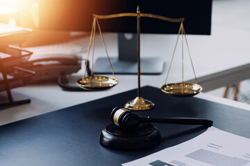 Male lawyer working with contract papers and wooden gavel on tabel in courtroom. justice and law ,attorney, court judge, concept.