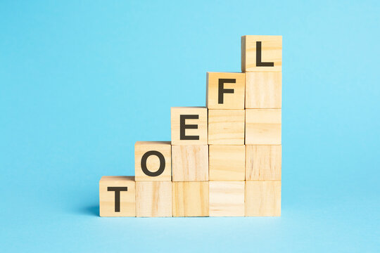 the word toefl is written on a wooden cubes, concept